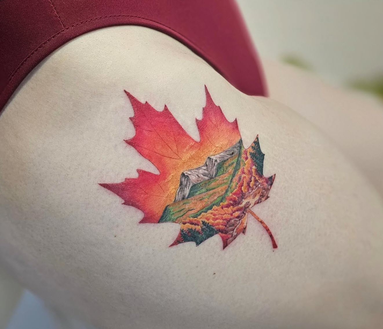 Be You Tattoo - Maple Leaf Tattoo with Mountains Tattooed into the Leaf